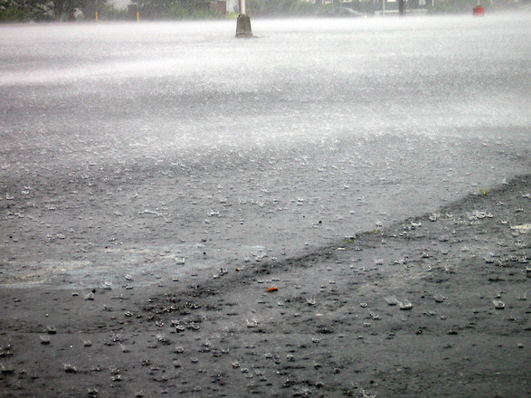 Heavy rain on large impervious areas, like parking lots and roadways, causes urban storm water runoff. (Photo courtesy of A. Dungan, IAN)